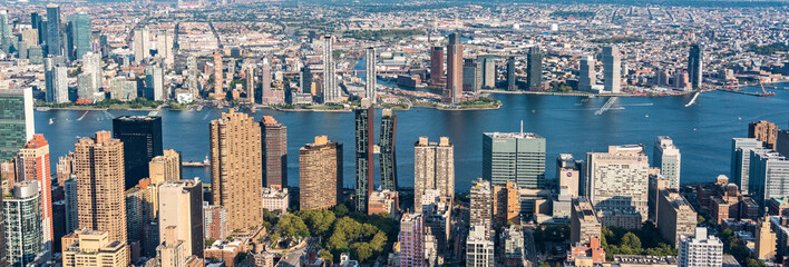 Panoramic aerial view of East river and skyscrapers of Manhattan