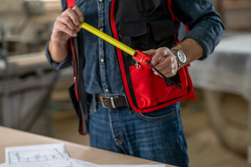Close up picture of a man in a working vest