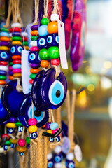 Traditional Turkish amulet Evil Eye or blue eye (Nazar boncugu). Souvenir of Turkey and traditional turkish amulet. Close up, selected focus. Travel souvenir or gift concept