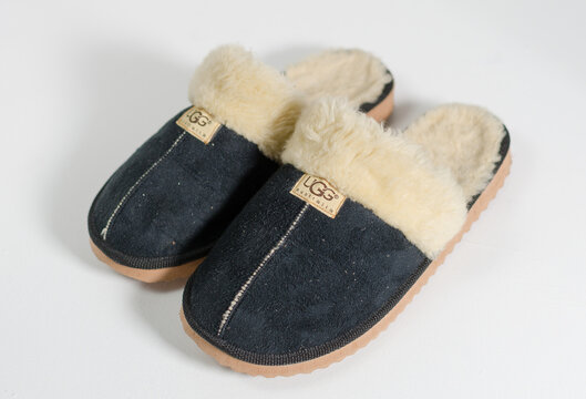 kent, uk, 09.09.2022 A pair of women sheepskin ugg furry comfy slippers. Fashionable uff sheep skin boots and footwear. Australian famous export fashion. UGG boots.