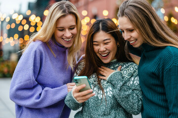 Group of friends in the street with smartphone
