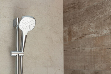 Shower head in the bathroom to spray water fixed on the wall