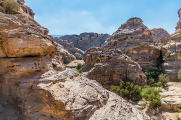 The rocky landscape above the gorge at Little Petra, Jordan in summertime