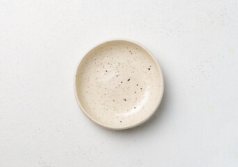 Empty bowl on white table top view