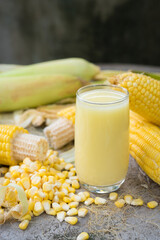 Yellow Sweet corn drink on wood  background , Yellow Corn juice, sweet corn milk, healthy organic food, bio nutrition