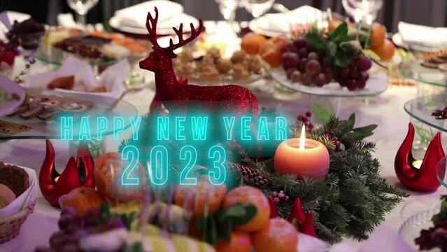 Animated text happy new year 2023, holiday table background. Text happy new year 2023. Happy new year 2023 bokeh background.