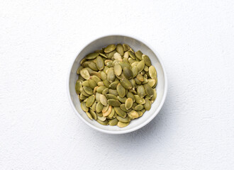 Pumpkin seeds in the white bowl