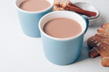 Hot chocolate. Two mugs of hot drink on Christmas winter morning.