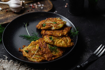 Potato pancakes in a bowl. Draniki.
