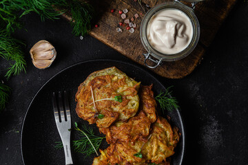 Potato pancakes in a bowl. Draniki.