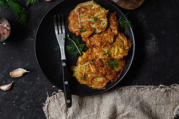 Potato pancakes in a bowl. Draniki.