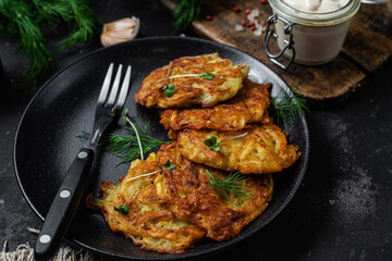 Potato pancakes in a bowl. Draniki.