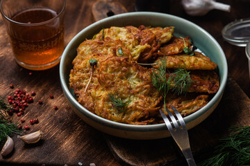 Potato pancakes in a bowl. Draniki.
