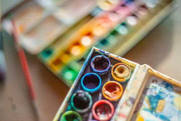 beautiful artistic abstract photography - colors and brushes and crayons in art studio - still life - shallow depth of field and artistic bokeh - Powered by Adobe