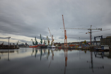 Fototapeta na wymiar Industrial shipyard with ships and cranes