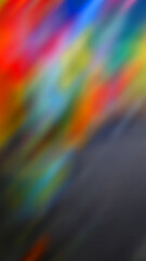 Abstract blurred background with various colors at the top, while at the bottom the gray color dominates.