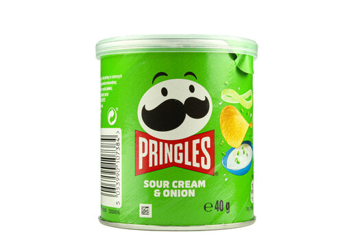 Small green Pringles sour cream and onion can package isolated on white background