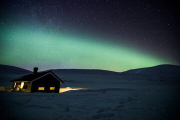 Northern lights in Reinheim Cabin, Dovrefjell National Park, Norway