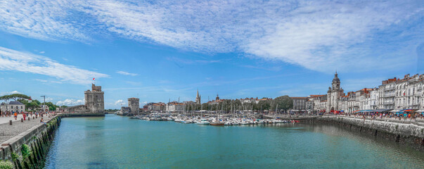 Obraz premium Wide panorama of the Old Port with medieval towers , La Rochelle, Southwestern France.
