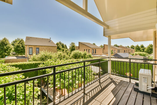 Views of various houses from the metal balcony