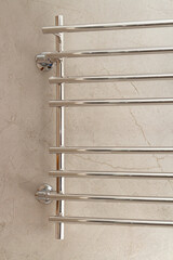 Modern stainless steel towel rack on the wall