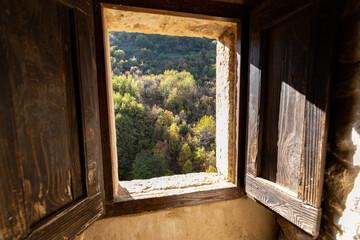 the colors of autumn through a window in the Majella National Park.. Abruzzo, Italy