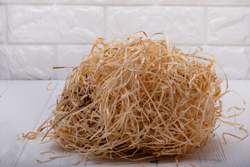 Wood shavings. Decorative packing material, natural wooden shredded wood shavings