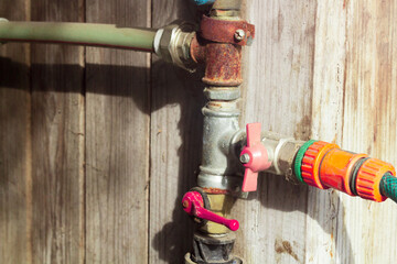 Water taps mounted on pipes and hoses