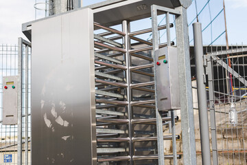 Steel rolling bars entrance of a stadium. Security turnstiles the entrance of an event