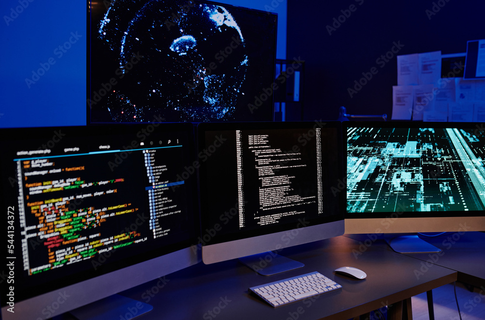 Poster Row of three computer monitors with coded data on screens standing on orkplaces of several modern IT engineers or programmers
