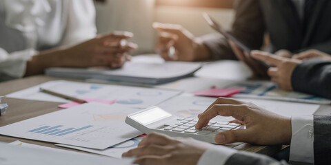 Asian business adviser meeting to analyze and discuss the situation on the financial report in the meeting room.Investment Consultant, Financial advisor and accounting concept