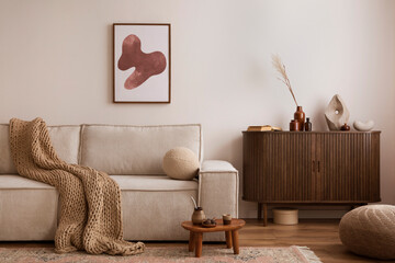 Craeative composition of living room interior with mock up poster frame, beige sofa, wooden...