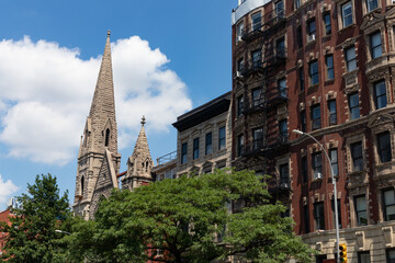 Row of Beautiful Old Residential Buildings and a Church in the East Village of New York City during the Summer