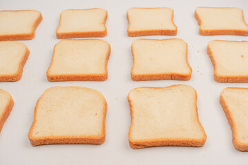 Delicious bread slices isolated on a white background, top view.