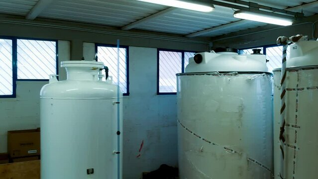 Slow motion view of a reverse osmosis system for water drinking plant. Water purification system, industrial environment from drone. technology concept