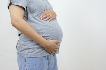 Close up of pregnant woman wearing gray t-shirt