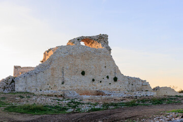 The walls of the castle ruins Kula Turnina near Rovij in Istria backlit at sunset