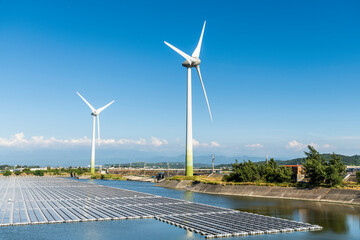 Combining wind power systems and solar power at Houlong Flood Detention Pond in Miaoli, Taiwan.