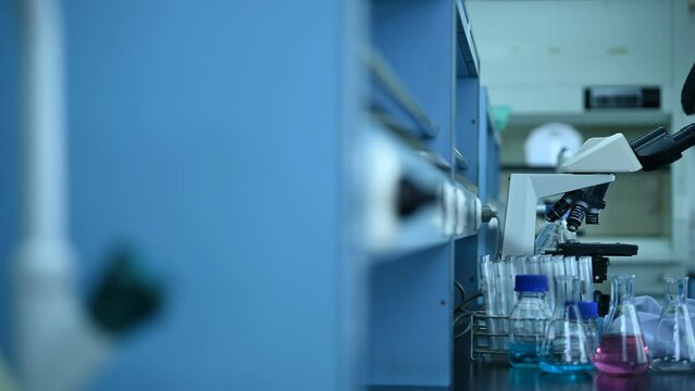 Asian scientist working in the lab,Female doctor use microscope for find experiment from sample,Thailand people,Researcher work in the laboratory
