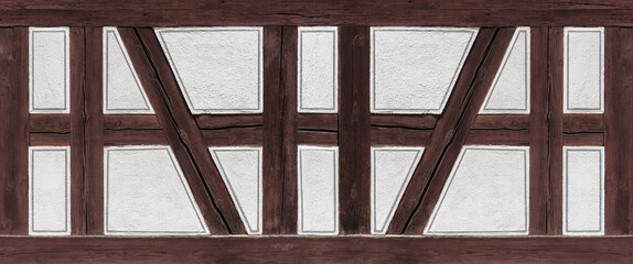 Fachwerk Detail - braune Holzbalken und weiß verputzte Zwischenräume mit aufgemalten grauen...