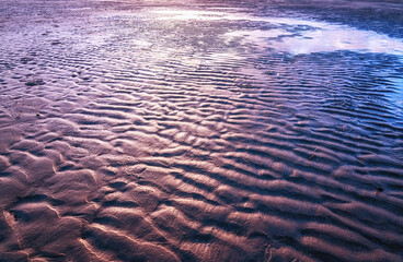 The pattern of mud sediment in the water for background.