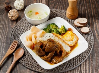 Padang Beef Rice with soup served in dish isolated on table side view of taiwan food