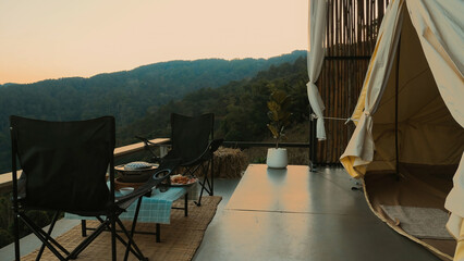 Modern resort with comfortable tent, terrace, folding camp chairs