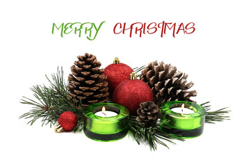 Christmas card. Christmas decoration with baubles, candles, pine cones and pine greens. Text Merry Christmas.