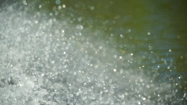 Slow motion video of water splashing from a boat.