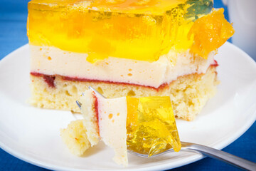 Homemade creamy fruit cake with jelly. Delicious dessert for different occasions