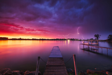 Lightning over Monona Bay during a colorful sunset. Madison, WI