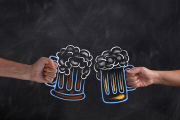 Two hands holding beer mugs drawn on blackboard