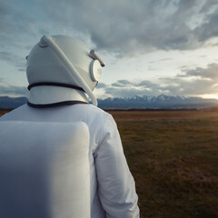 An astronaut in a spacesuit explores an unknown planet.