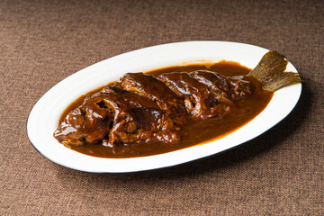 Braised crucian carp on a simple background